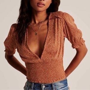 Abercrombie & Fitch top, orange with white dots.